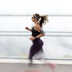 woman running wearing armband